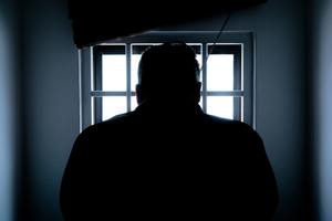 Silhouette of prosecuted man